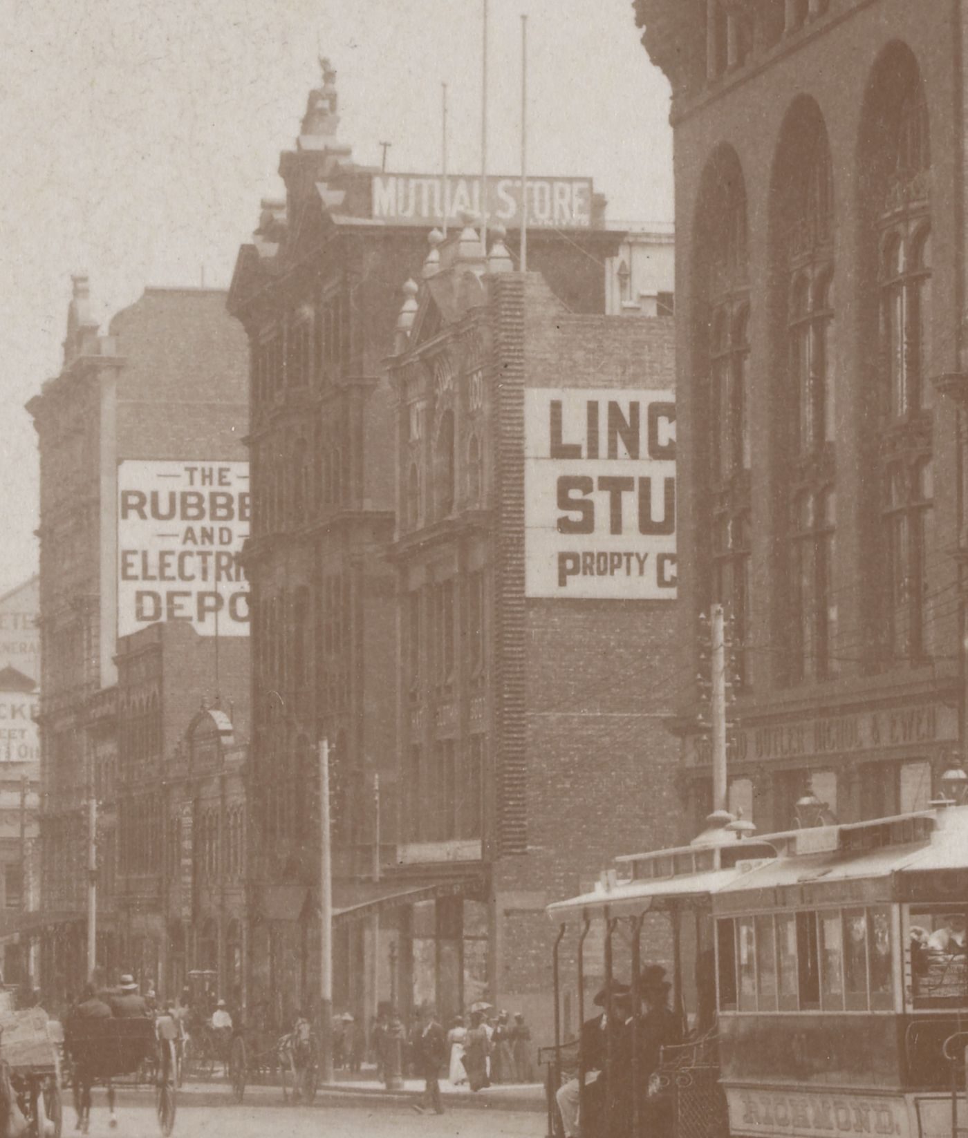 Flinders Street in the 1890s, the rebuilt store with MUTUAL STORE on its roof and a cable tram in front.